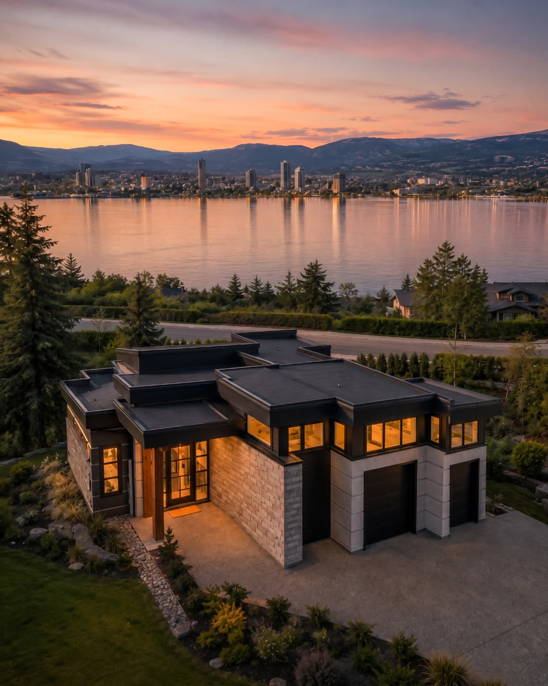 The Hawthorne on Lot 12 at Rosevale Estates: rendering of a flat roof contemporary custom home in stone and dark cladding above Okanagan Lake, West Kelowna