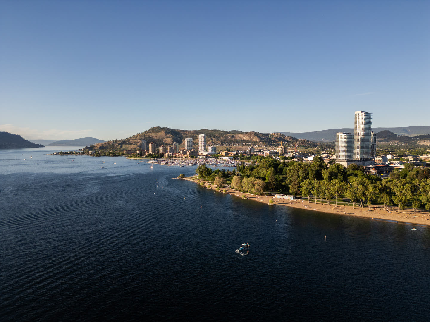 Downtown Kelowna and the marina seen across Okanagan Lake from the West Kelowna side